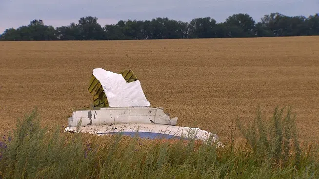 Personal belongings scattered in the ashes of the MH17 flight that crashed in Ukraine.