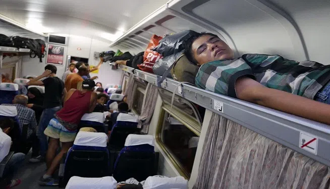 Refugees Sleep on Train