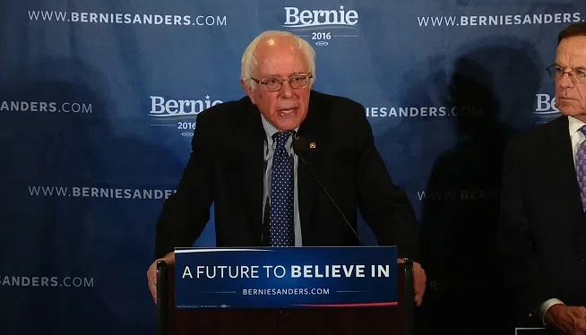 Bernie Sanders stood by his pledge to outline his health care plan before the Iowa caucuses amid criticism from Hillary Clinton and conflicting statements from within the Vermont senator's campaign about whether he will meet his own deadline.