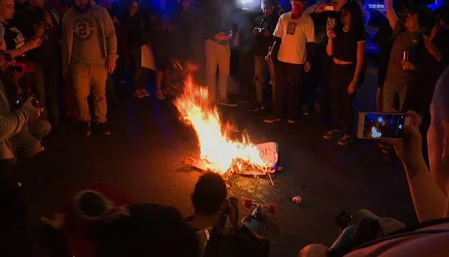 The American flag was burned near the Georgia State Capital in an anti-Trump protest on November 11, 2016.