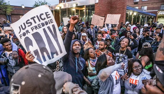 Protesters rally near the courthouse in Baltimore, Maryland on Wednesday, September 2, 2015, as six Baltimore police officers charged in Freddie Gray's death are due in court.