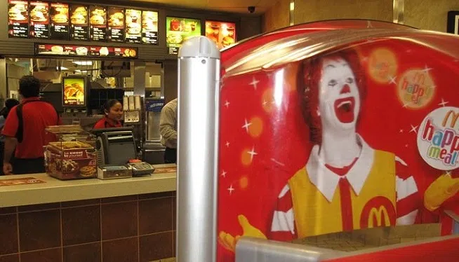 Burger King is facing a big threat from a resurgent McDonald's -- and feuding with Wendy's on social media. Shares of Mickey D's are up nearly 35% over the past year and sales are surging thanks to all day breakfast and some new menu items.