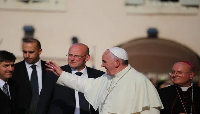 FILE -- The people of Assisi, Italy greet Pope Francis on October 4, 2013.