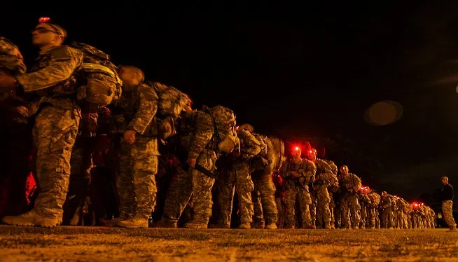 Army Soldiers participate in the Darby Queen obstacle course as part of their training at the Ranger Course on Ft. Benning Ga., June 28, 2015