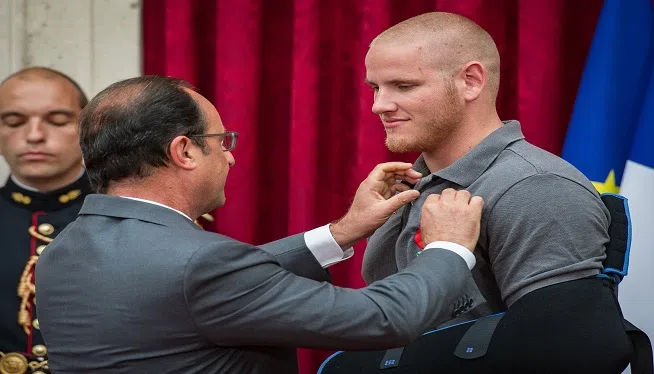 French President François Hollande pins the Legion of Honor on U.S. Airman 1st Class Spencer Stone during a ceremony at the Élysée in Paris Aug. 24, 2015, following a foiled attack on a French train. Stone was on vacation with his childhood friends, Aleksander Skarlatos and Anthony Sadler, when an armed gunman entered their train carrying an assault rifle, a handgun and a box cutter. The three friends, with the help of a British passenger, subdued the gunman after his rifle jammed. Stones medical training prepared him to begin treating wounded passengers while waiting for the authorities to arrive. Stone is an ambulance service technician with the 65th Medical Operations Squadron stationed at Lajes Field, Azores.