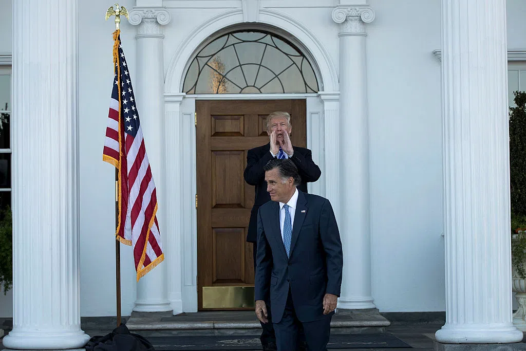 BEDMINSTER TOWNSHIP, NJ - NOVEMBER 19: President-elect Donald Trump calls out to the press as Mitt Romney leaves after their meeting at Trump International Golf Club, November 19, 2016 in Bedminster Township, New Jersey. Trump and his transition team are in the process of filling cabinet and other high level positions for the new administration.  (Photo by Drew Angerer/Getty Images)
