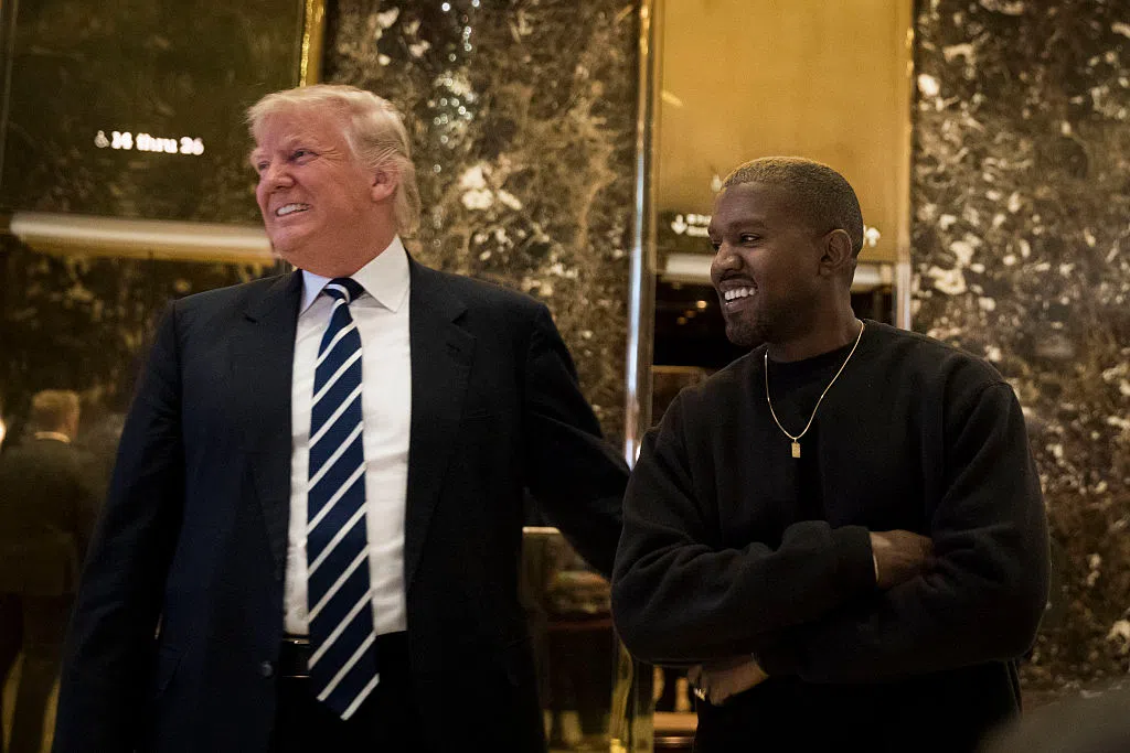 NEW YORK, NY - DECEMBER 13: (L to R) President-elect Donald Trump and Kanye West stand together in the lobby at Trump Tower, December 13, 2016 in New York City. President-elect Donald Trump and his transition team are in the process of filling cabinet and other high level positions for the new administration. (Photo by Drew Angerer/Getty Images)