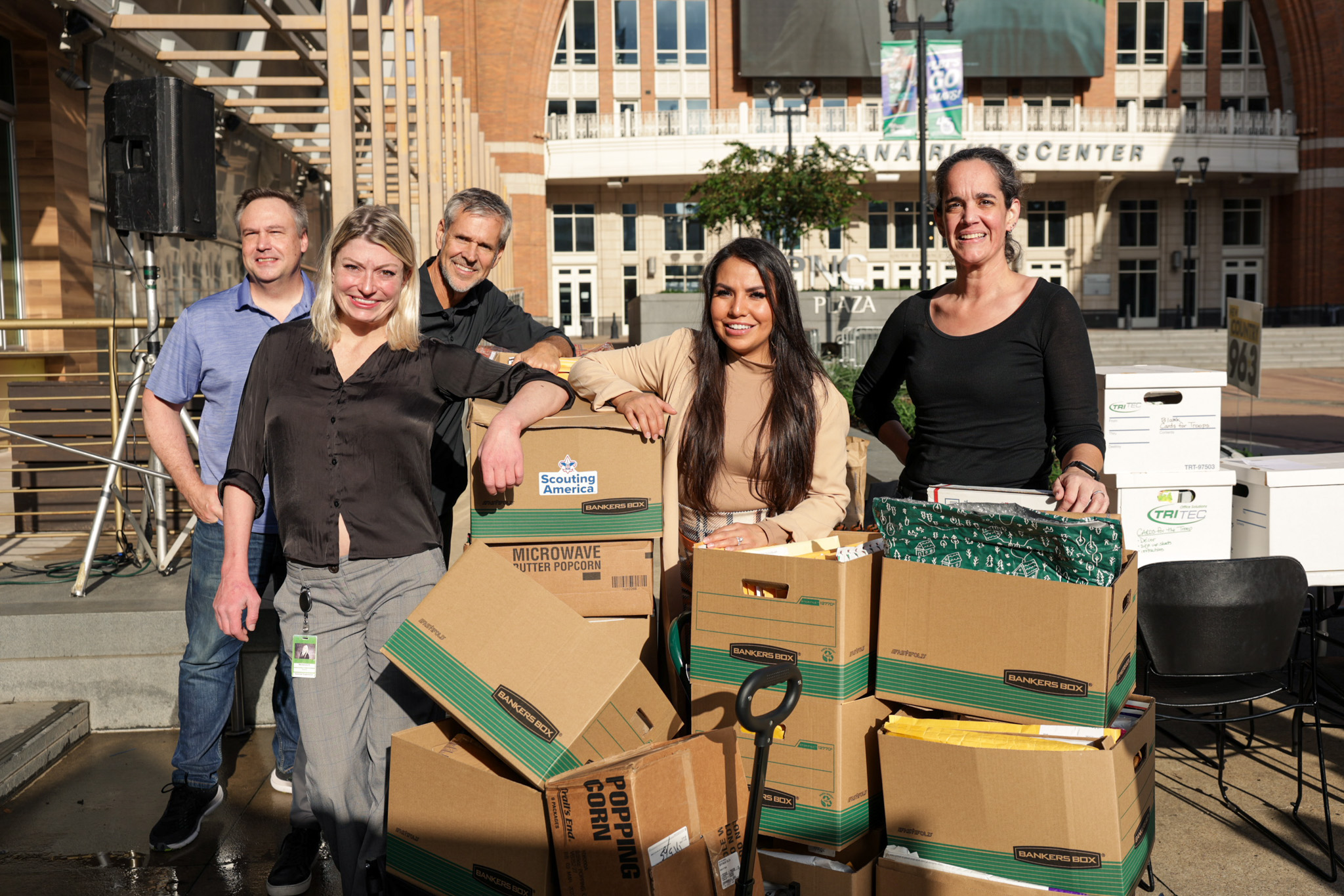 Campaign participants gathered beside boxes of donated cards at PNC Plaza.