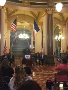 Wayne Ford, co-founder of Iowa Black and Brown Forum, speaks before a crowd at the capitol.