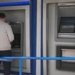 A man using an ATM