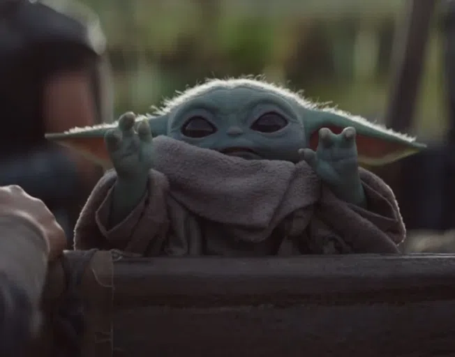 Baby Yoda with a cookie on 'The Mandalorian'