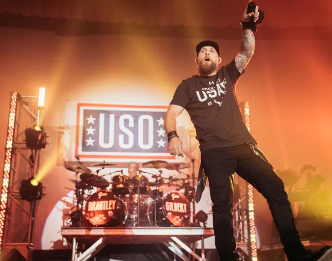 Brantley Gilbert on stage during USO concert