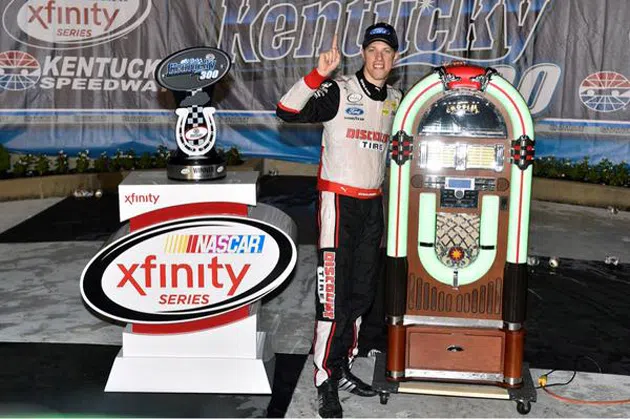 Brad Keselowski with trophy and jukebox