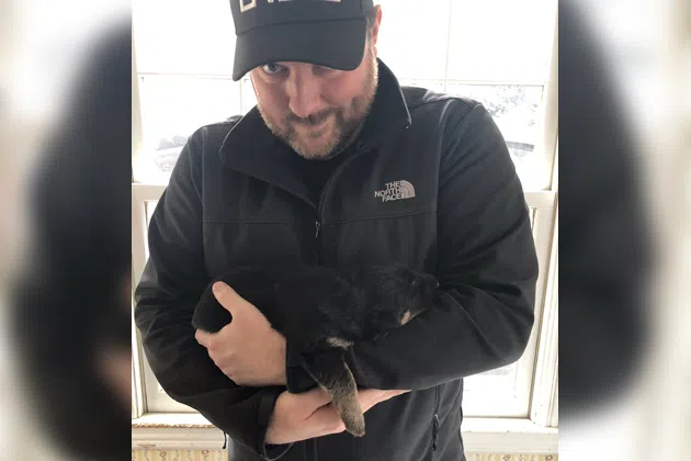 Chris Young holding his puppy