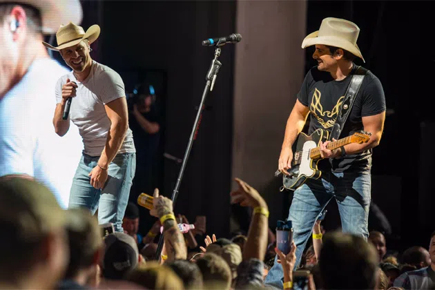 Dustin Lynch and Brad Paisley on stage