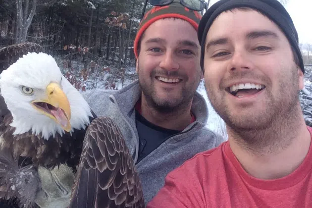 Michael and Neil Fletcher with a bald eagle