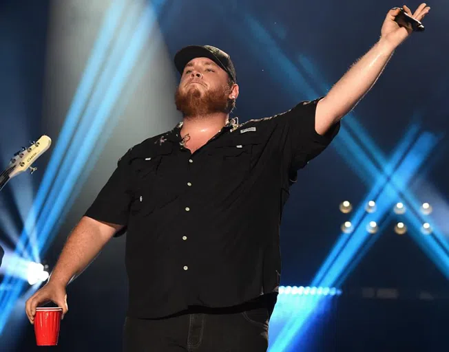 Luke Combs on stage at Grossinger Motors Arena in Bloomington, IL