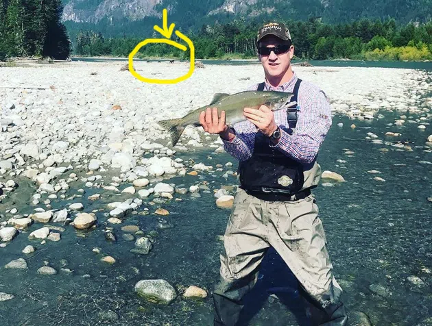 Peyton Manning holding a fish
