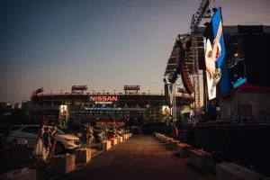 Brad Paisley on stage at a drive-in concert event.