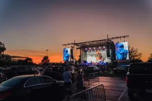 Brad Paisley on stage at a drive-in concert event.