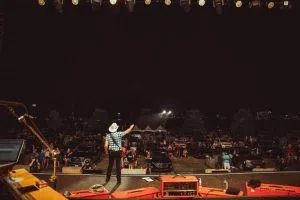 Brad Paisley on stage at a drive-in concert event.