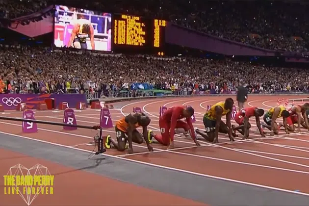 Runners lined up at starting line on track