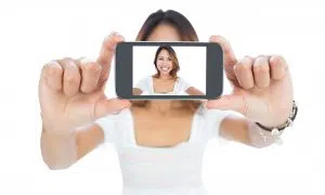 Happy asian woman taking a selfie