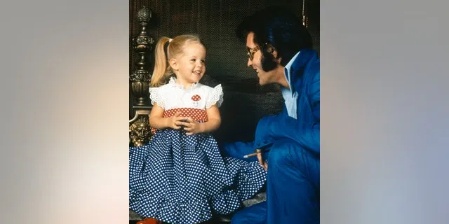 American rock legend Elvis Presley with his daughter Lisa-Marie Presley.