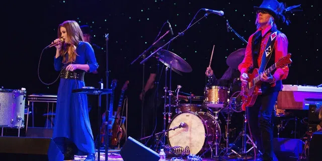 Lisa Marie Presley and performs on stage with husband and guitarist Michael Lockwood at the Triple Door Theater on August 28, 2013 in Seattle, Washington.