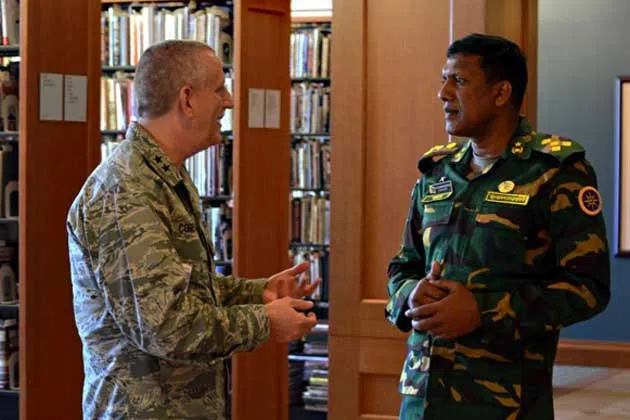 Brig. Gen. Mohammad Shamsuzzaman, of the Bangladesh Army discusses the Illinois Air National Guard with Maj. Gen. William Cobetto of Hillsboro, Illinois, Assistant Adjutant General-Air, Illinois National Guard, during the foreign defense attachés visit April 27 at the Pritzker Military Library and Museum in Chicago. (U.S. Army National Guard photo by Staff Sgt. Robert R. Adams, Illinois National Guard Public Affairs)