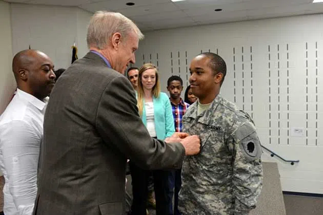 Bruce Rauner, Pfc. Justin Malone