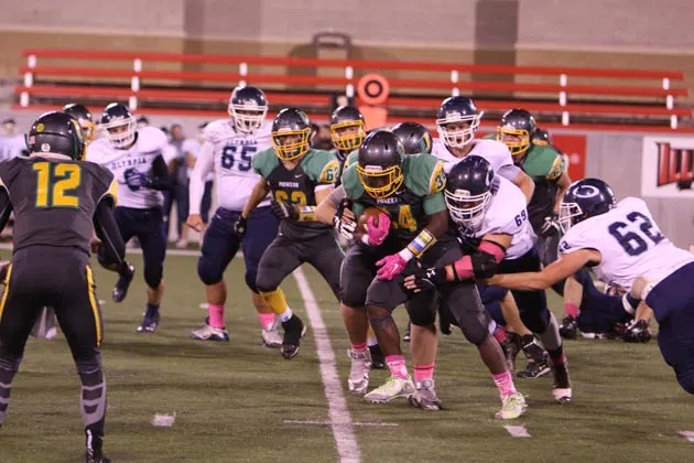 Jo Jo Hughes broke tackles down the field for a 40 yard touchdown during the second half as the Pioneers took down Olympia. (Sandy Adams/YNIS)
