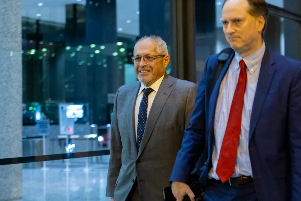 Fidel Marquez, a former Commonwealth Edison executive-turned-cooperating witness, leaves the Dirksen Federal Courthouse with his attorney on Tuesday, Nov. 12, 2024, after his fifth day of testimony in the bribery and racketeering trial of former Illinois House Speaker Michael Madigan. (Capitol News Illinois photo by Andrew Adams)