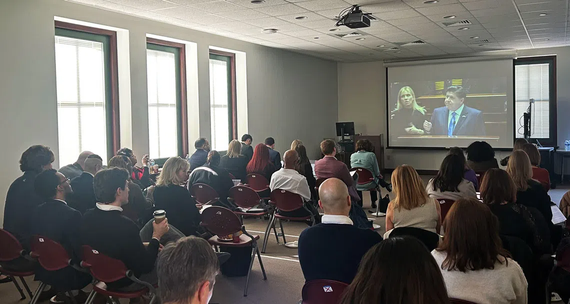 Lobbyists with a variety of health and human service organizations across Illinois watch Gov. Pritzker’s annual budget address at the Illinois State Library Wednesday, Feb. 18, 2026. (Medill Illinois News Bureau by George Alexandrakis)