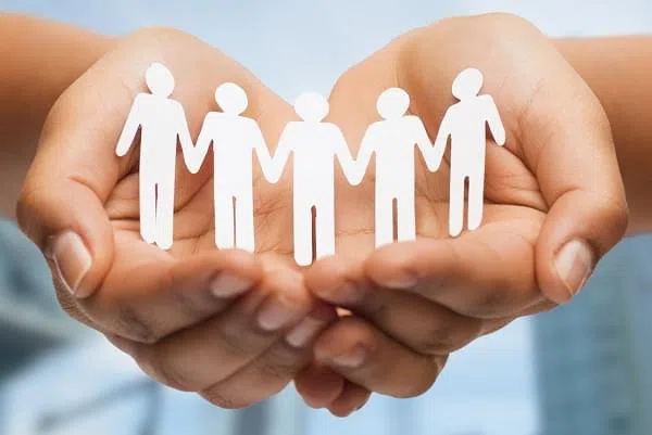 relationships and love concept - womans hands showing paper cutout team