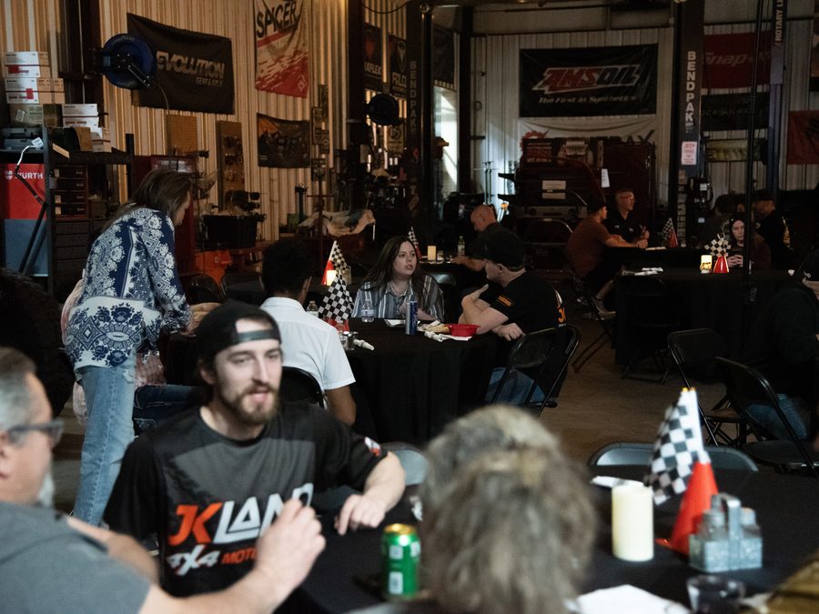 Crowd gathered at tables during a JKLand event