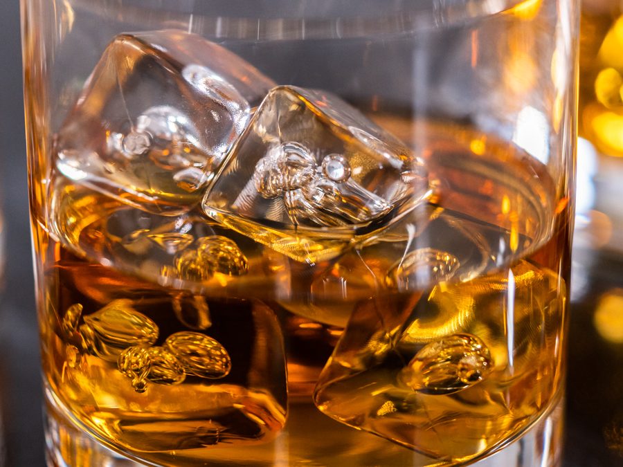 Glass of whiskey on ice