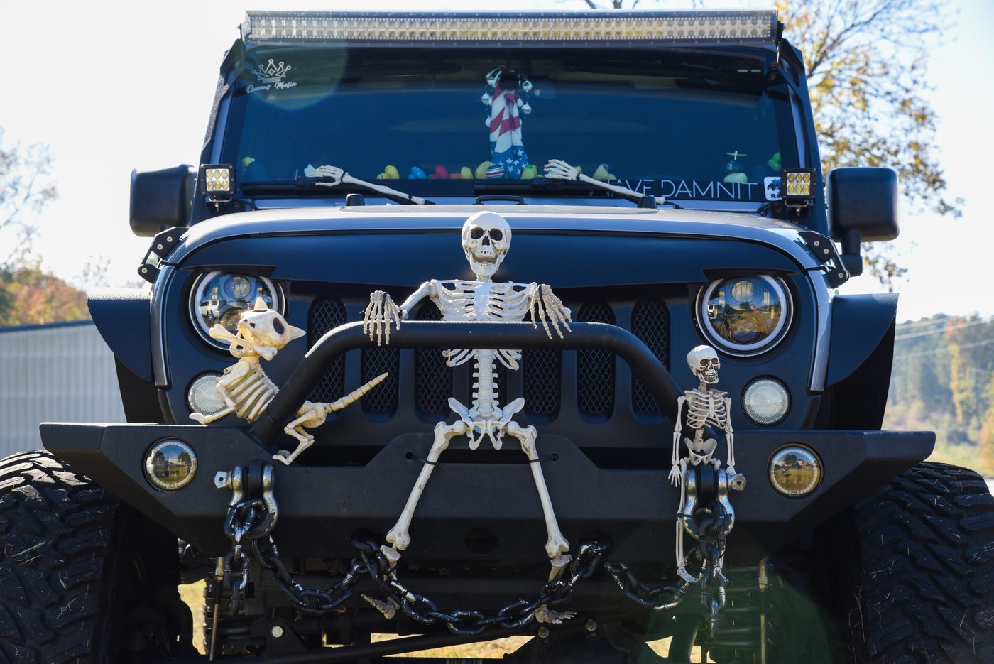 Black Jeep decorated with skeletons for Halloween