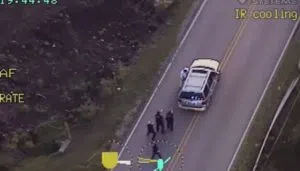 In this image made from a Friday, Sept. 16, 2016 police video, Terence Crutcher, top, is pursued by police officers as he walk to an SUV in Tulsa, Okla. Crutcher was taken to the hospital where he was pronounced dead after he was shot by the officer around 8 p.m., Friday, police said. Crutcher had no weapon on him or in his SUV, Tulsa Police Chief Chuck Jordan said Monday, Sept. 19, 2016. (Tulsa Police Department via AP)