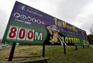 A Billboard is seen near the border of the Alabama State line, as lottery tickets are not sold in Alabama, in Fayetteville, Tenn., Friday, Jan. 8, 2016. With Powerball sales breaking previous records, the odds are growing that someone will win Saturday night's $800 million jackpot, but if no one matches all the numbers, the next drawing is expected to soar past $1 billion. (Bob Gathany/AL.com via AP) MANDATORY CREDIT