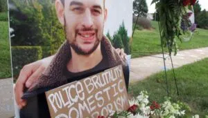 A photo of Daniel Kevin Harris stands by a makeshift memorial in his Charlotte, N.C., neighborhood on Wednesday, Aug. 24, 2016. Harris, who was deaf, was shot by a state trooper last week in a traffic stop that turned deadly. The family of Harris said he was unarmed and suggested the sequence of events was a tragic misunderstanding — the type the state's training manual warns troopers to avoid. (AP Photo/Allen G. Breed)