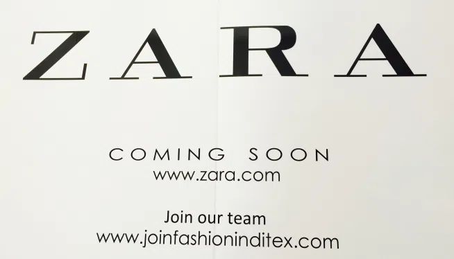 Currently concealing the renovations to the two-level retail store in Providence Place is this "Coming Soon" veil.
