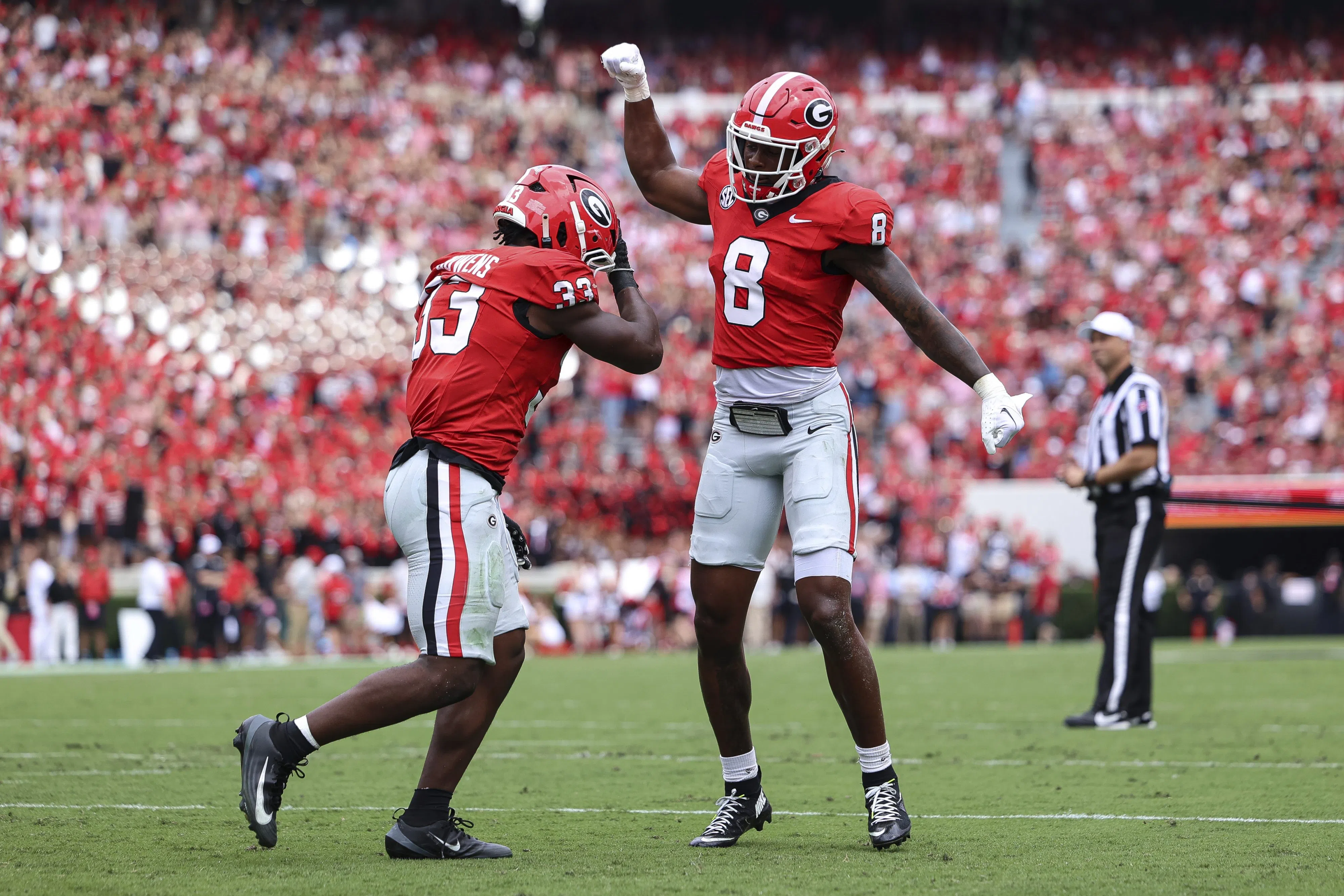 Georgia Bulldogs running back Chauncey Bowens (33) celebrates with wide receiver Colbie Young (8) after scoring a touchdown.