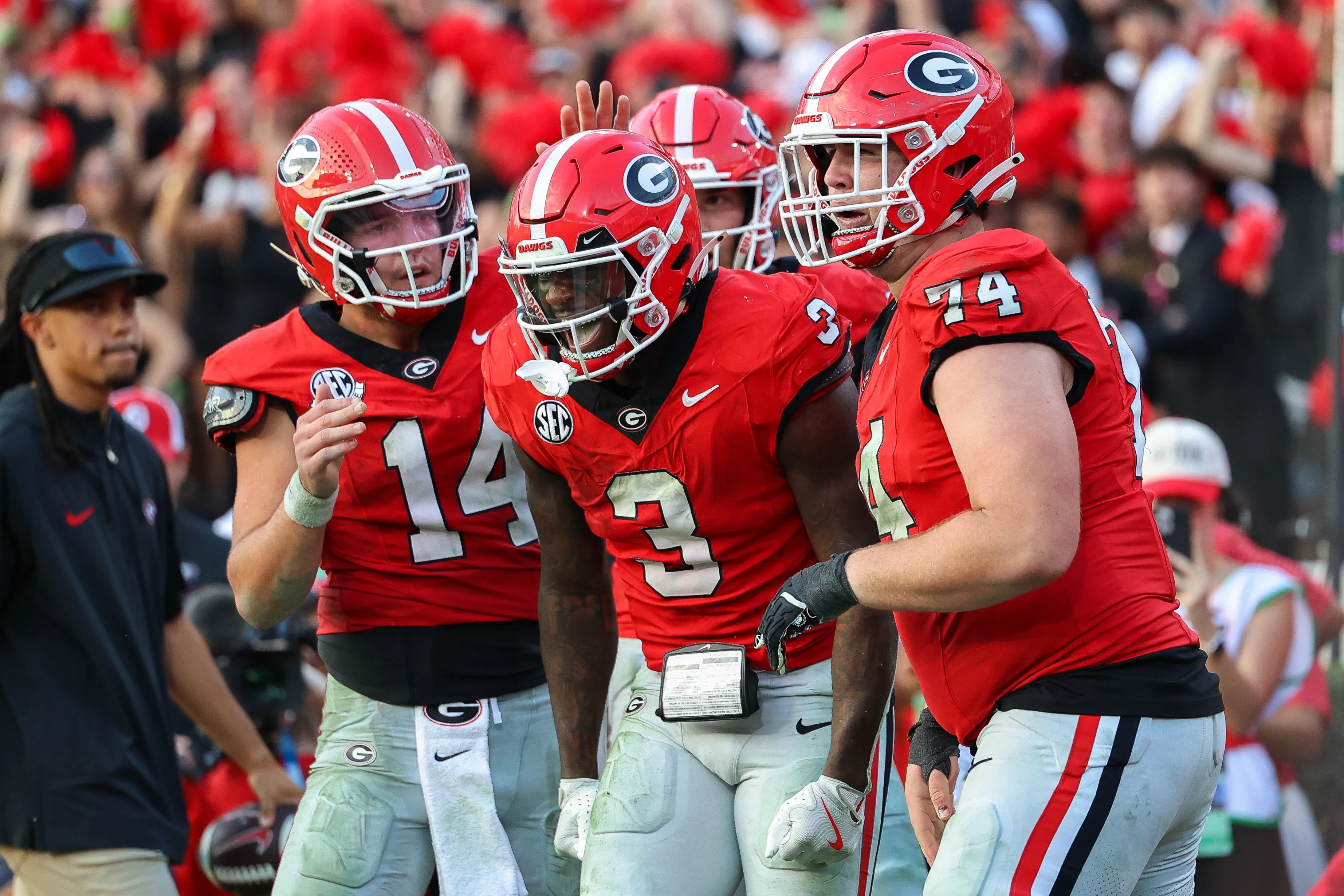 Georgia running back Nate Frazier (3) with QB Gunner Stockton (14) and offensive lineman Drew Bobo (74).