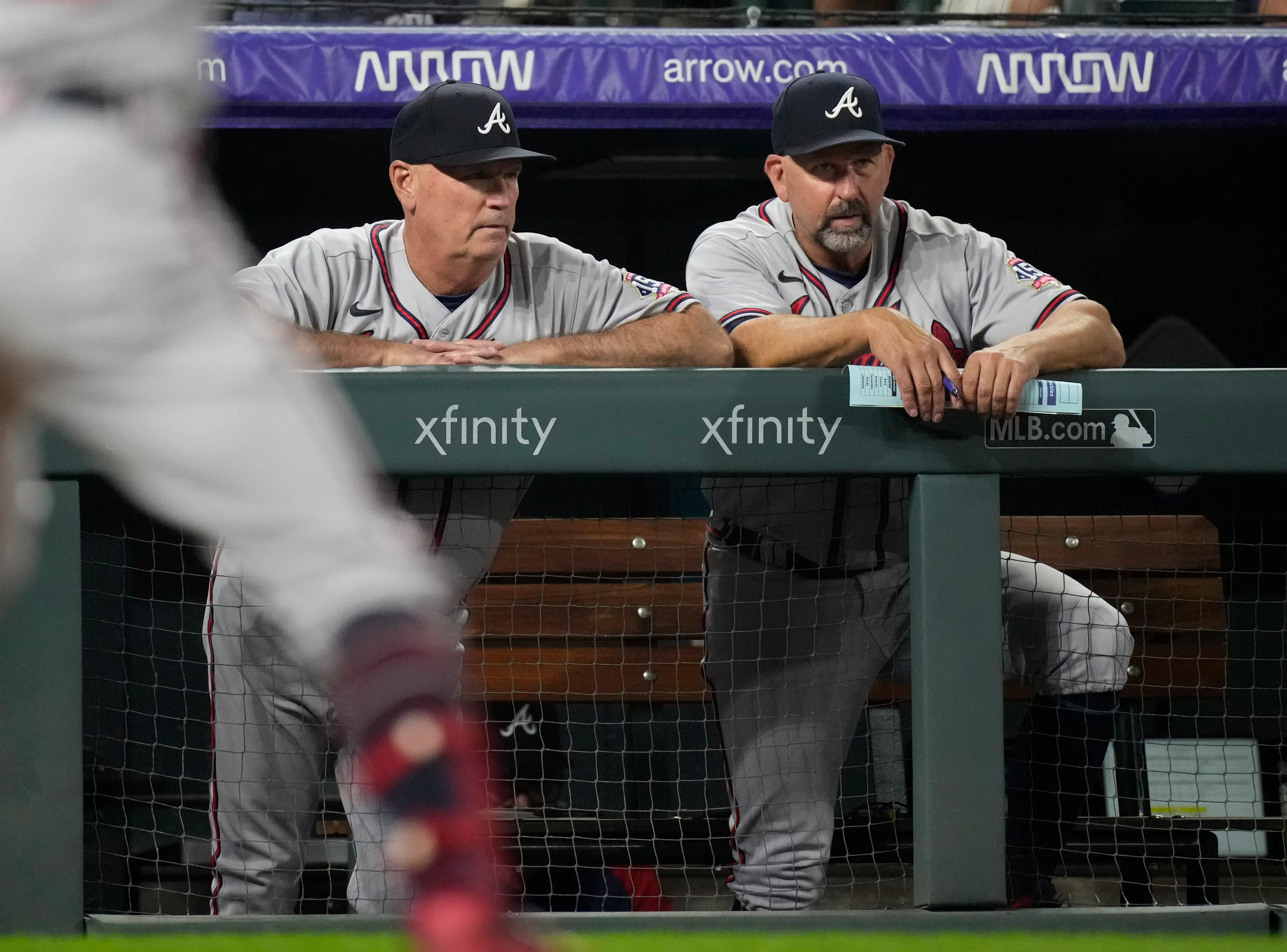 Atlanta Braves manager Brian Snitker, left, looks on with bench coach Walt Weiss