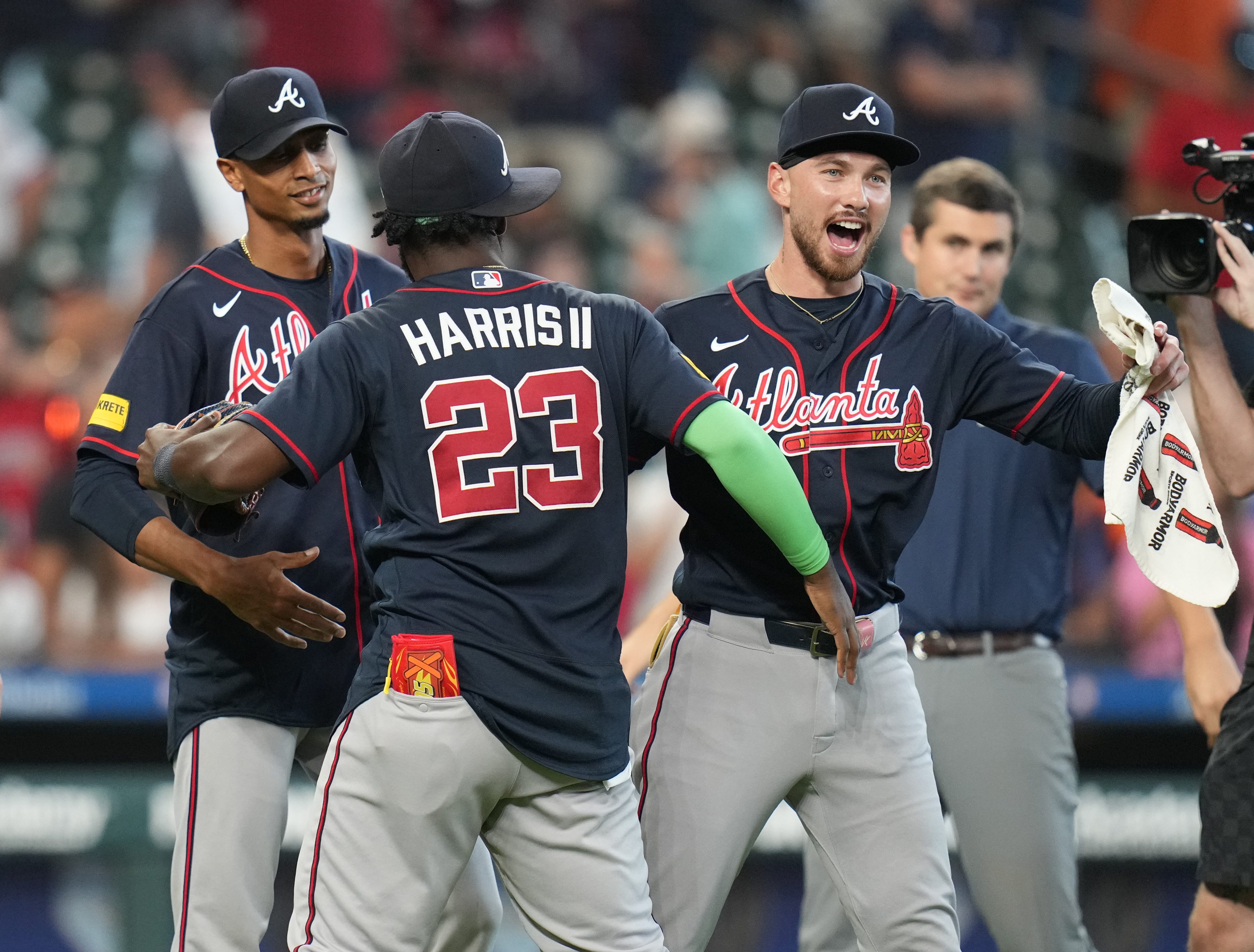 Atlanta Braves' Michael Harris II (23) and DaShawn Keirsey Jr., front right, celebrate on the field after a baseball game against the Houston Astros 