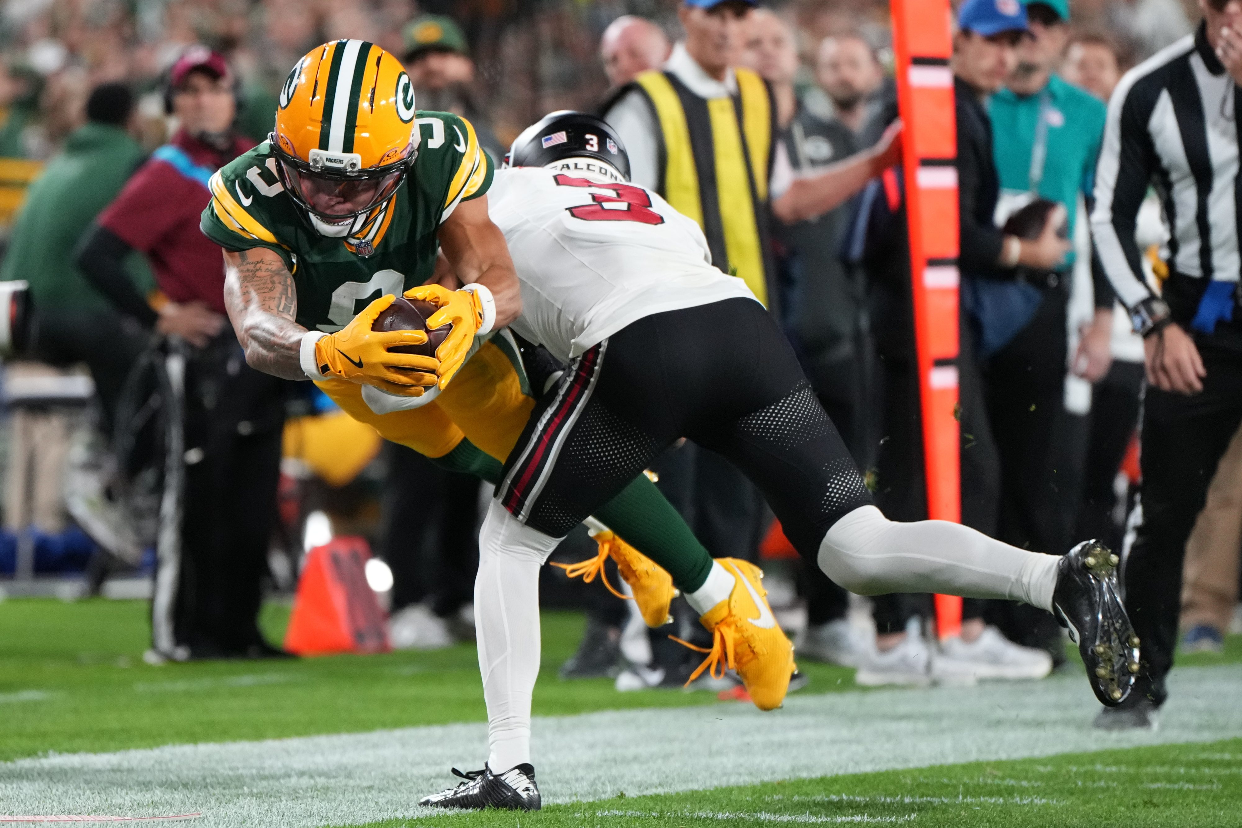 Atlanta Falcons' Jessie Bates III stops Green Bay Packers' Christian Watson