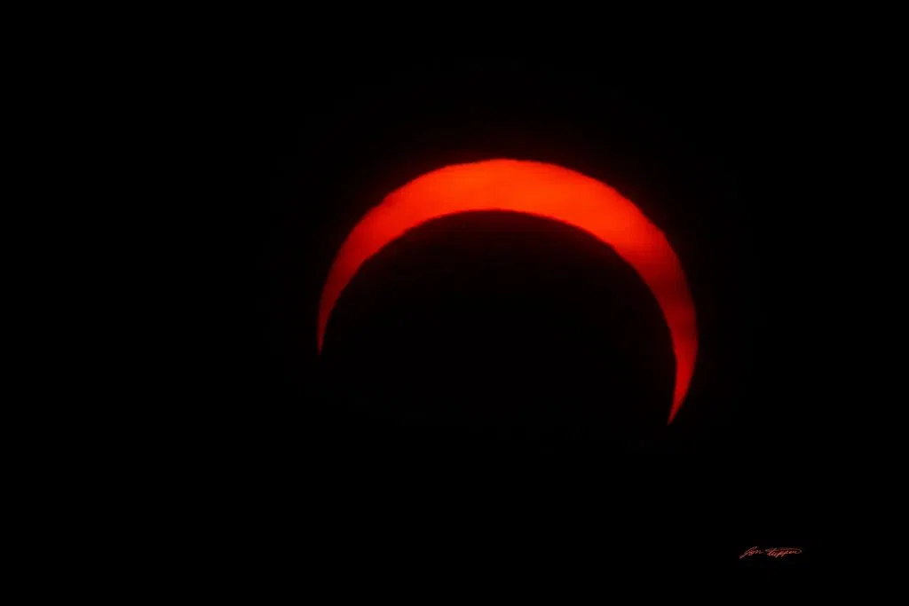 Partial eclipse over Andrew Lake, Alberta. June 10, 2021. Photo by Jon Tupper