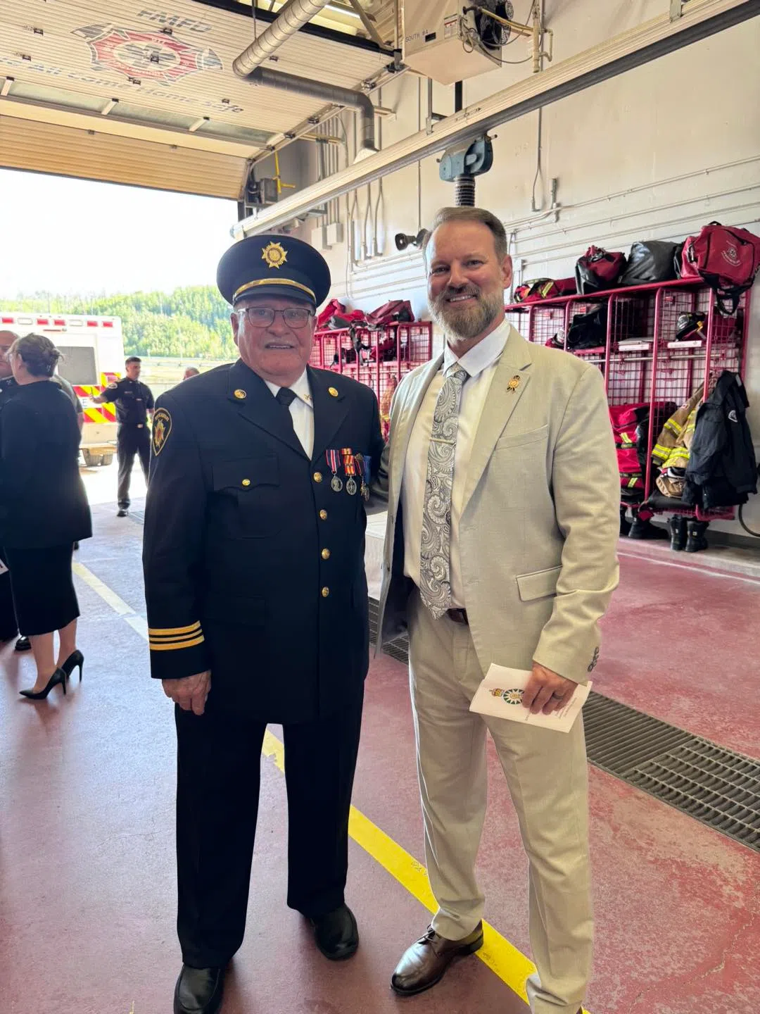 Left: Firefighter Joe Gauthier (Ret) with Mayor Sandy Bowman. Image via Mayor Sandy Bowman (right) Facebook post