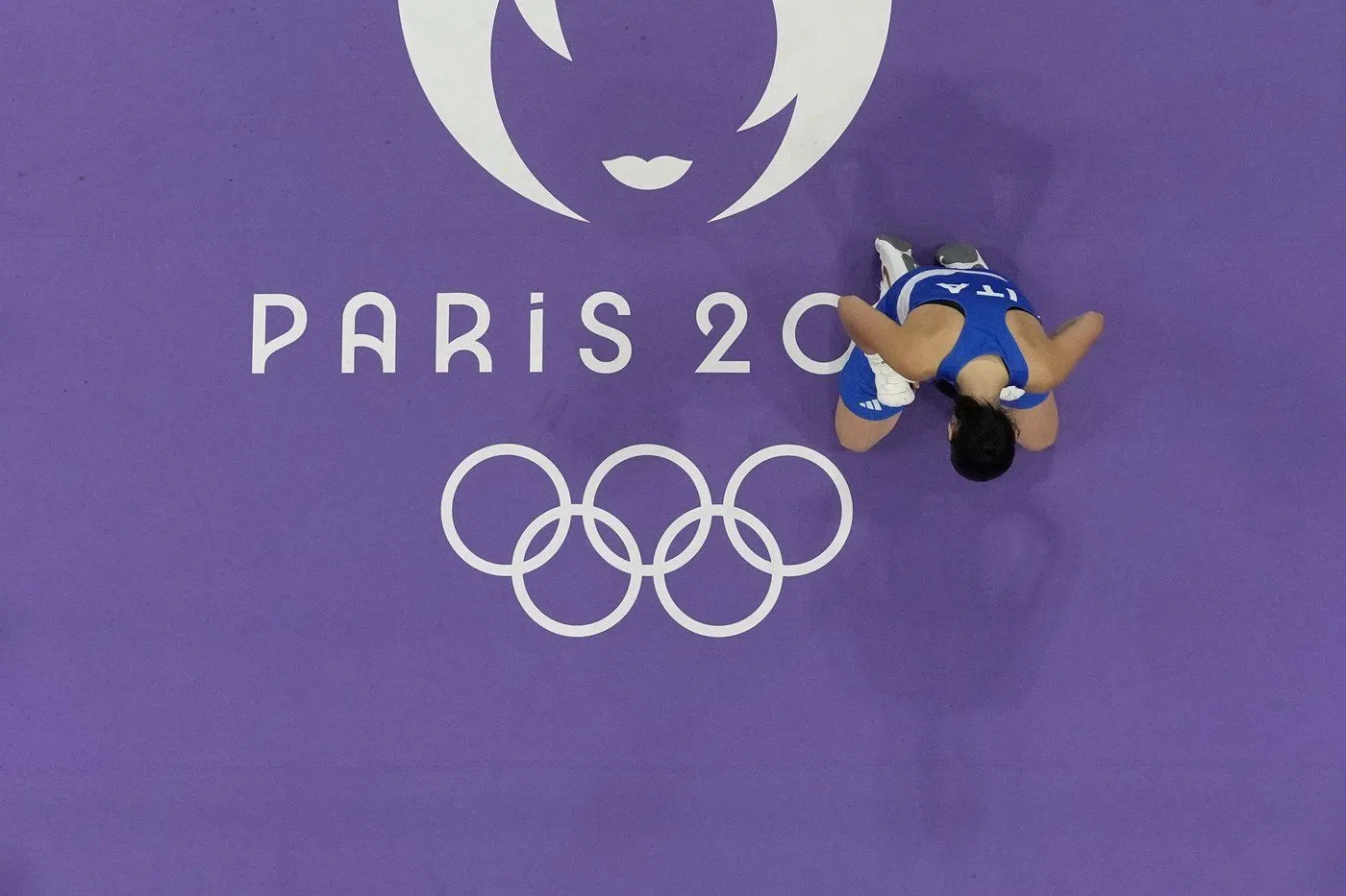 Italy's Angela Carini reacts after she abandoned her fight against Algeria's Imane Khelif in their women's 66kg preliminary boxing match at the 2024 Summer Olympics, Thursday, Aug. 1, 2024, in Paris, France. (AP Photo/John Locher)